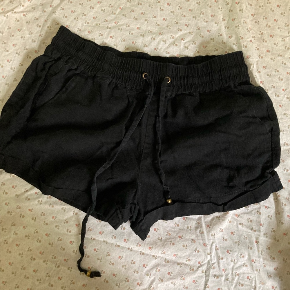 black drawstring shorts with front and back pockets